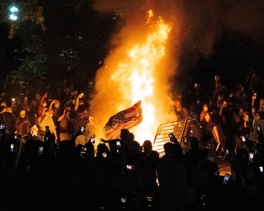 Crowds set fire to U.S. and Israeli flags in Tehran